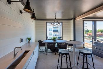 a kitchen and dining area in a 555 waverly unit at The Livano Tryon, North Carolina